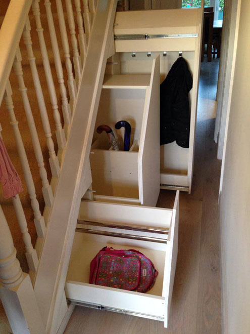 https://ingrained.ie/wp-content/uploads/2014/01/Custom-made-pull-out-under-stairs-storage-for-childrens-coats-bags-and-sports-equipment.jpg