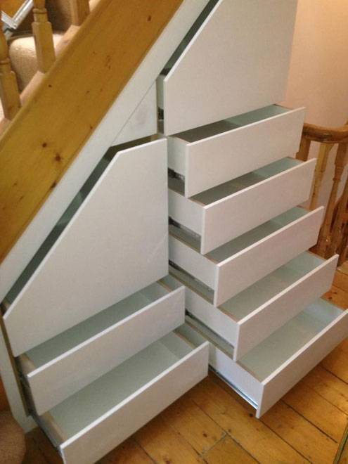 https://ingrained.ie/wp-content/uploads/2014/01/Multiple-drawers-in-tall-landing-under-stairs-space-open-front.jpg